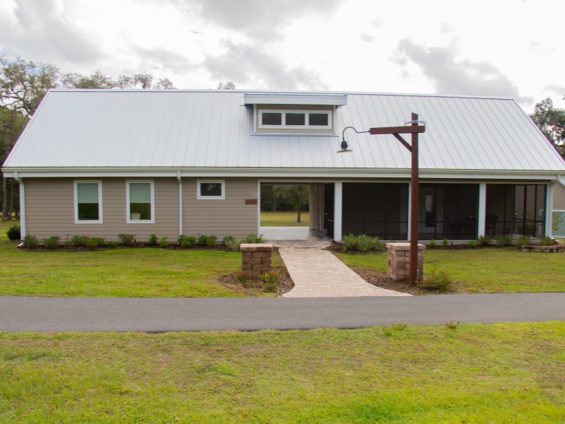 An exterior view of a cabin and walking path